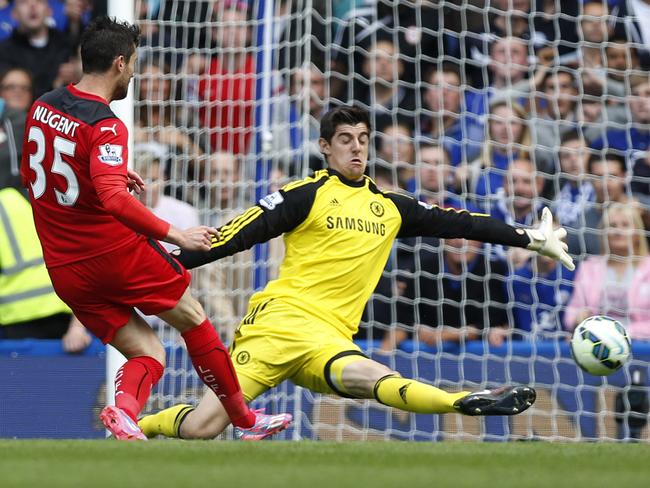 Thibaut Courtois pulls off an important save against Leicester.