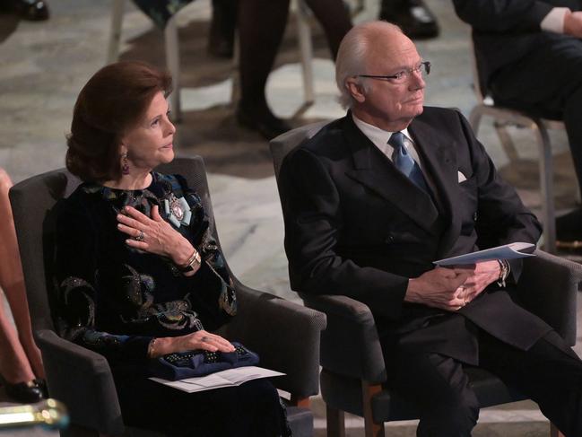 Sweden's King Carl XVI Gustaf and Queen Silvia attend a ceremony for the 2021 Nobel prize laureates at the Stockholm City Hall. Both have tested positive for Covid despite being triple vaccinated. Picture: AFP