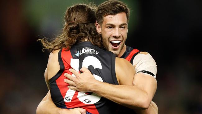 MELBOURNE, AUSTRALIA - MAY 23: Archie Perkins (L) and Kyle Langford of the Bombers celebrate during the 2021 AFL Round 10 match between the Essendon Bombers and the North Melbourne Kangaroos at Marvel Stadium on May 23, 2021 in Melbourne, Australia. (Photo by Michael Willson/AFL Photos via Getty Images)