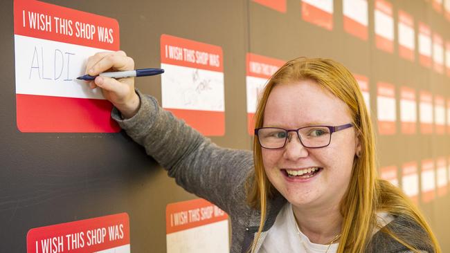 Belinda O'Halloran adds her desire for and Aldi to the wall. Picture: Eugene Hyland