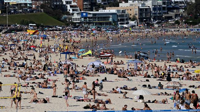 Crowds of people at Sydney's Bondi Beach. State premiers in NSW and Victoria have begun outlining COVID-safe plans to control overcrowding at beaches and avoid a spike in infections during the summer holidays. Picture: NCA NewsWire/Bianca De Marchi