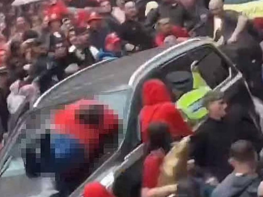 Screen grabs of video of the car as it ploughed into the packed crowd of football fan.