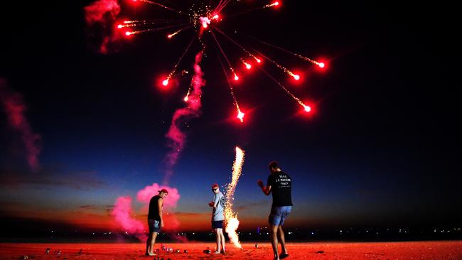 Darwin locals Dustin Fletcher, Cameron Nadj and Andrew Cozens let off fireworks at Little Mindil.