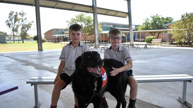 Jake Griffiths and JJ Greenaway, from OLSCC, with Story Dog Sammy. Picture: Sam Flanagan