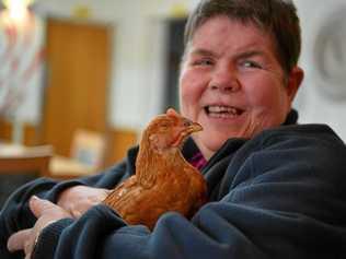 FEATHERED FRIEND: Lutheran Services' Immanuel Gardens resident Clare Connelly hangs out with one of the facility's chickens. Picture: John McCutcheon