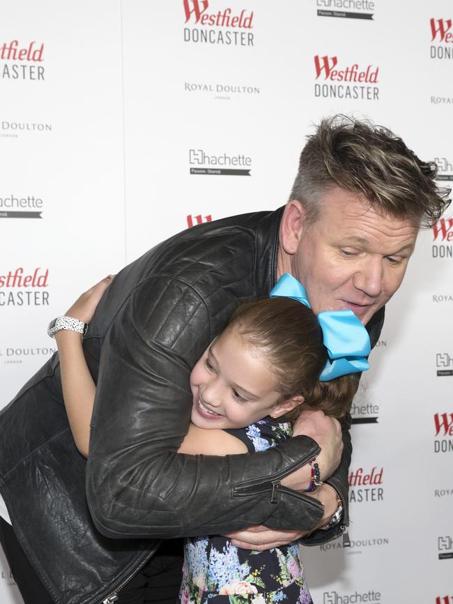 Gordon Ramsay gets a big hug from a little fan. Picture: Sarah Matray