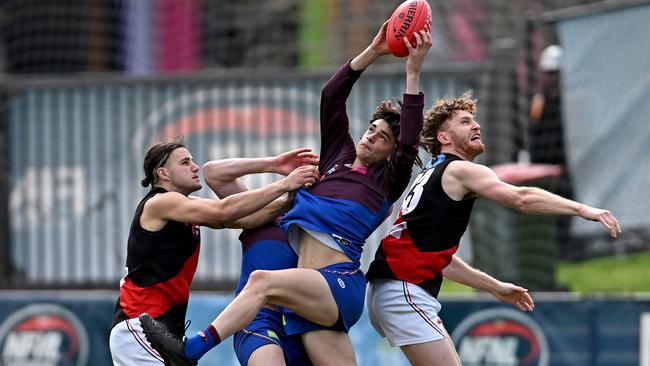 James Kayrooz takes a contested mark for Banyule against Eltham. Picture: Andy Brownbill