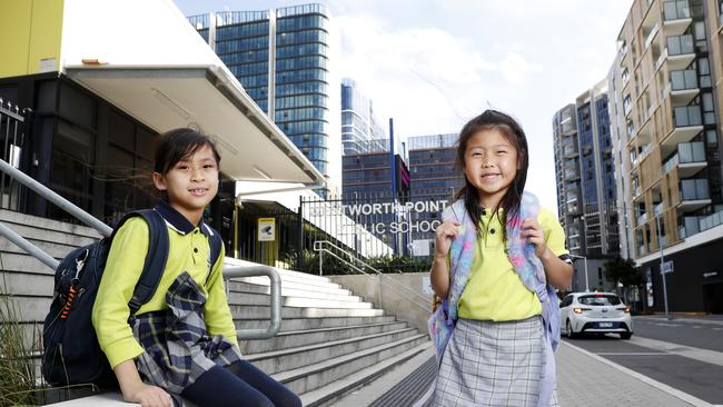 Students Madison Miranda and Jacqueline Tjie outside Wentworth Point Public School in November. Picture: Jonathan Ng