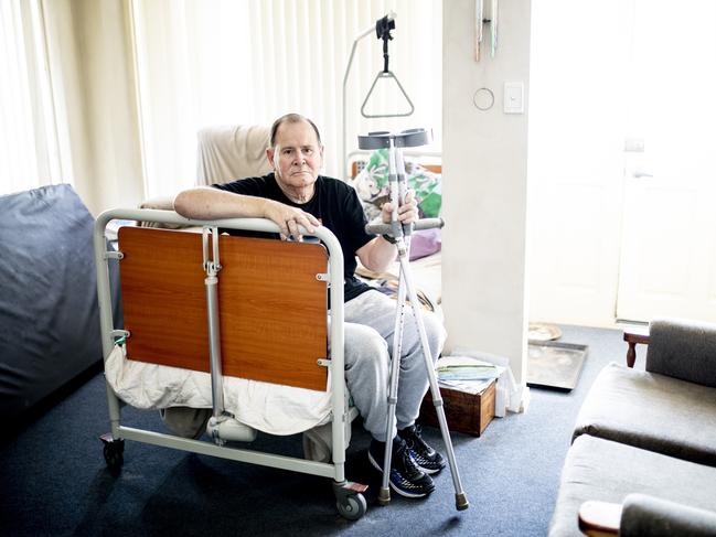 74-year-old Bill Winters is in a wheelchair and lives in, social housing at Sorell. Due to accessibility issues he sleeps on a hospital, bed in his living room and finds it difficult to get into the bathroom. Picture: EDDIE SAFARIK