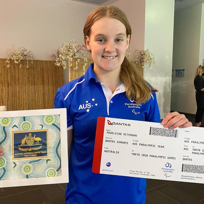 Former Coffs swimmer Maddie McTernan with her ticket to Tokyo.