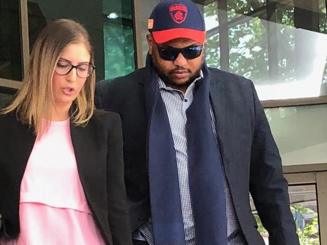 19-10-18 - Mohamed Osmar Omar who allegedly defrauded the NDIS of more than $480,000 with his lawyer Giselle Nehma outside Melbourne Magistrates Court this morning. Tessa Akerman