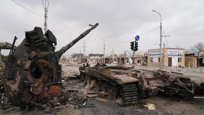 A wrecked tank is seen as civilians are being evacuated along humanitarian corridors from the Ukrainian city of Mariupol. (Photo by Stringer/Anadolu Agency via Getty Images)