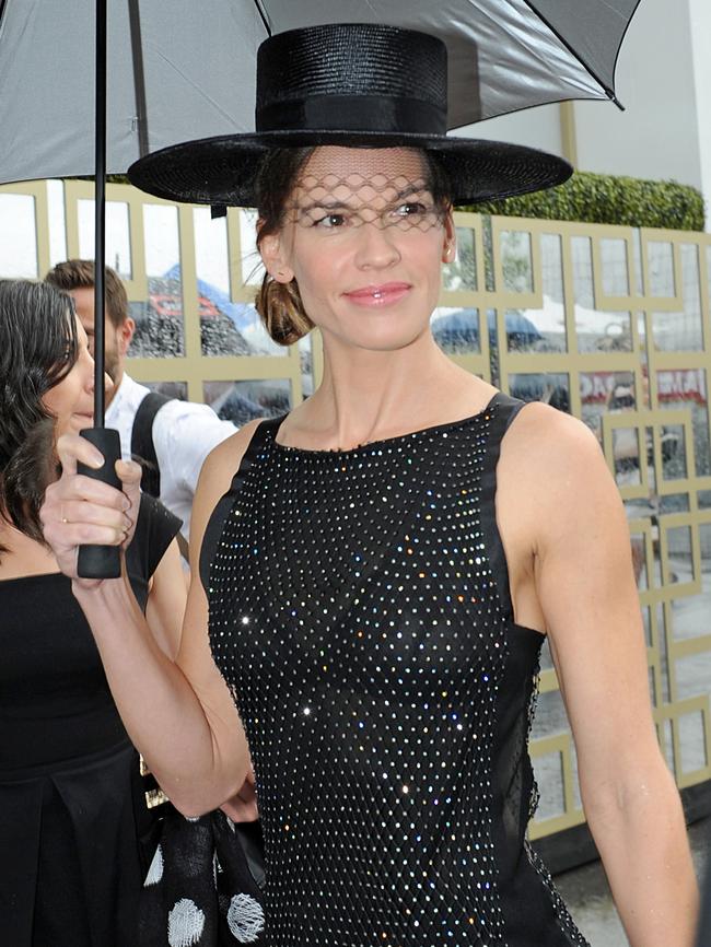 American actress Hilary Swank walks to the Swisse marquee at the Birdcage on Derby Day at Flemington race course in Melbourne, Saturday, Oct. 31, 2015. Picture: AAP Image/Joe Castro.