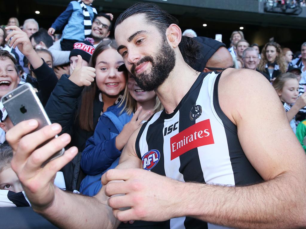 Brodie Grundy of the Magpies just casually checking his SuperCoach scores after the game — another 140+ effort no doubt!