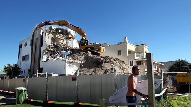 The mansion being demolished in 2012. Among those who had lived in it were Michael Edgley, Ken Lacey, Terry Page, John Wade and Rod Galt. Picture: Luke Marsden.