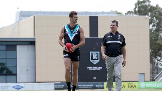 Port Adelaide ruckman Scott Lycett and five-time Magpies premiership player David Hutton, who is now back working at the club, ahead of Port’s 150th gala dinner on Friday night. Picture: AAP/Kelly Barnes