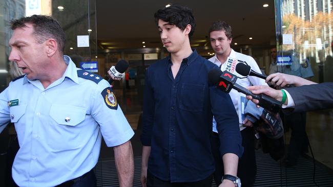 Former Lindt Cafe siege hostage Jarrod Morton-Hoffman (centre) leaving the Lindt Cafe siege inquest findings in Sydney, Wednesday, May 24, 2017. Picture: AAP /David Moir.