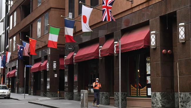 A man walks past the Stamford Plaza Hotel in Melbourne. Picture: AFP