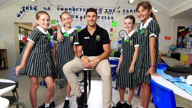 Qweekend - teacher of the year awards. Corey Micari from Trinity Lutheran College, Ashmore has been nominated. He's a Year 5 teacher and ex footballer. With students Mackenzie Kennedy 10, Kayla Hansmeyer 10, Jessica Auckland 10, Peyton McFarlane 10. Pics Adam Head