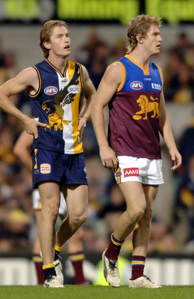 Troy Selwood in his AFL playing days with Brisbane Lions pictured with twin brother, former Eagle Adam. Picture: JACKSON FLINDELL