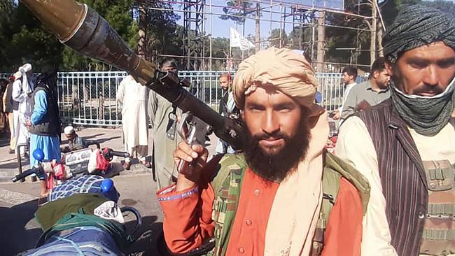 Taliban fighters have begun to enter the Afghan capital Kabul. Here a Taliban fighter holds a rocket-propelled grenade along the roadside in Herat. Picture: AFP