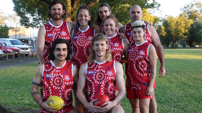 INDIGENOUS JUMPER: Ahead of the indigenous Round on May 29, 2021, players from the Lismore Swans senior men's and women's squads don the distinctive jumper designed by teammate and proud Bundjalung woman, Talarra Berry. L-R Front – Kubilay Karhan and Hendrik Hoogendoorn. Back – Lucas Foenander, Emma Stoddart, Samuel Coates, Laura Cahill, Matthew Schafer and Liv Castanga Photo: Alison Paterson