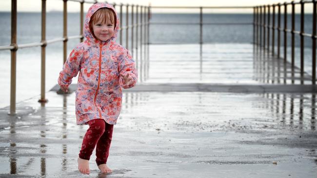 Beatrice Hastings braves a walk along the pier in Melbourne’s Albert Park on Wednesday. Picture: Andrew Henshaw