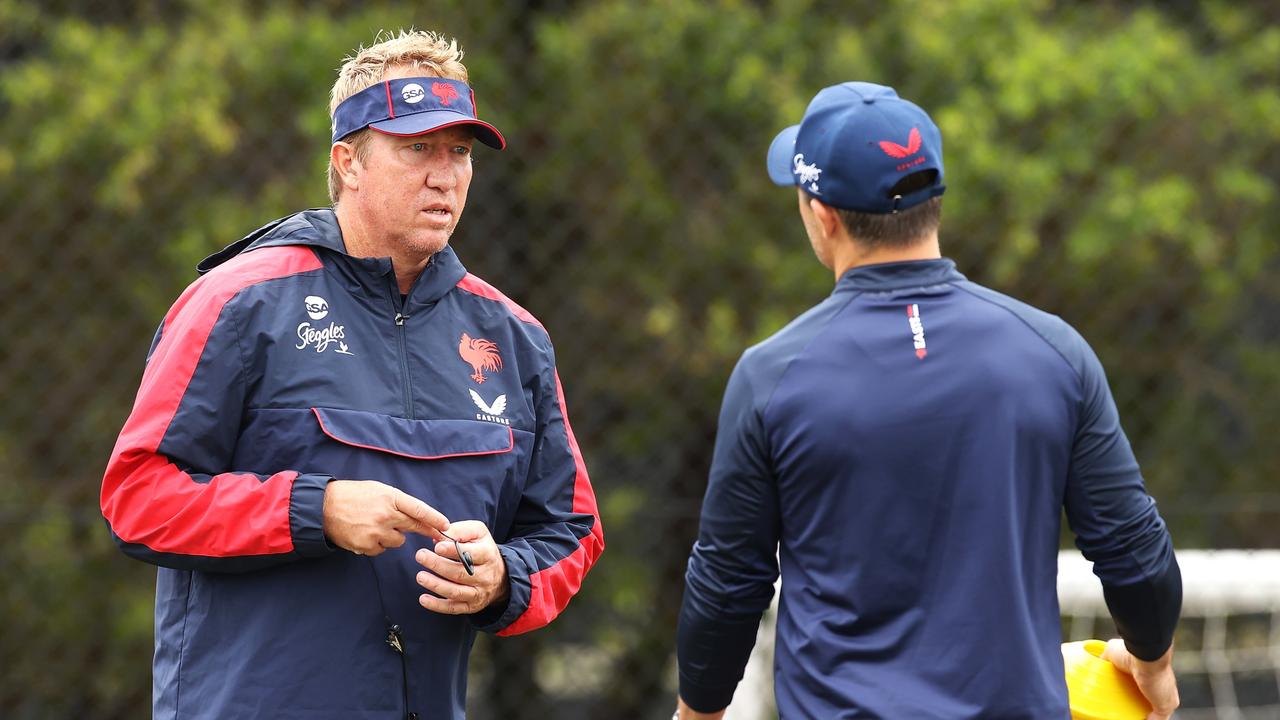 SYDNEY, AUSTRALIA - MARCH 07: Rooster head coach Trent Robinson speaks to Cooper Cronk during a Sydney Roosters NRL training session at Robertson Road Synthetic Field on March 07, 2022 in Sydney, Australia. (Photo by Mark Kolbe/Getty Images)