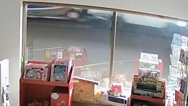 A white four-door ute and the boat/trailer can be seen passing the window of the shop in the CCTV. Police believe the occupiers could assist with their inquiries.