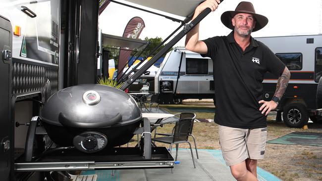 Robbie Cochrane of Caravan HQ shows off the mod cons on the On The Move Traxx caravan at the 2020 Cairns Expo. Picture: Brendan Radke