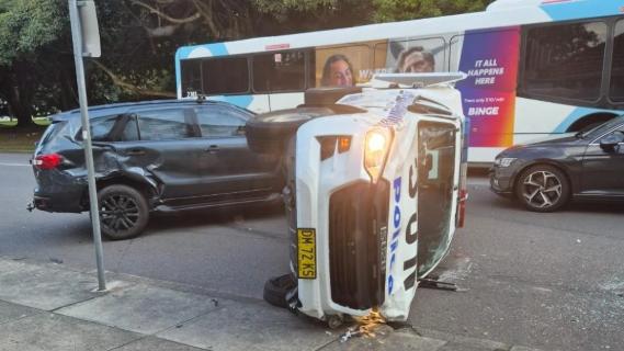 A police vehicle has ended up on its side at Islington following a pursuit through suburban Newcastle. Picture: Supplied