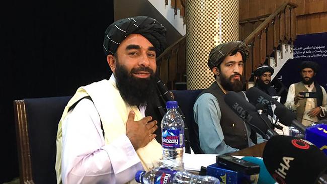 Taliban spokesperson Zabihullah Mujahid, left, attends the first press conference in Kabul on August 17 following their stunning takeover of Afghanistan. Picture: AFP