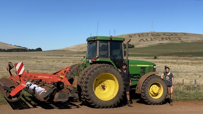 Farmer Anthony Fraser and daughter Joee ploughed the message “Piss off Ausnet” into their property in protest of the The Western Victoria Transmission Network Project.