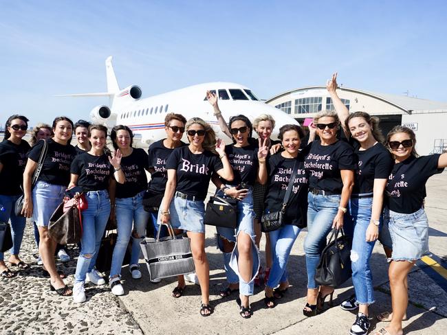 A group shot by the private jet. Picture: Nathan Richter