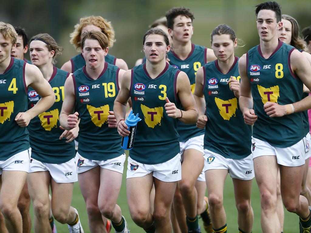 AFL - Tasmania Devils under-18 team in NAB League game against the Northern Knights at Twin Ovals, Kingston. (L-R)The team running on the field after the half time break. Picture: MATT THOMPSON