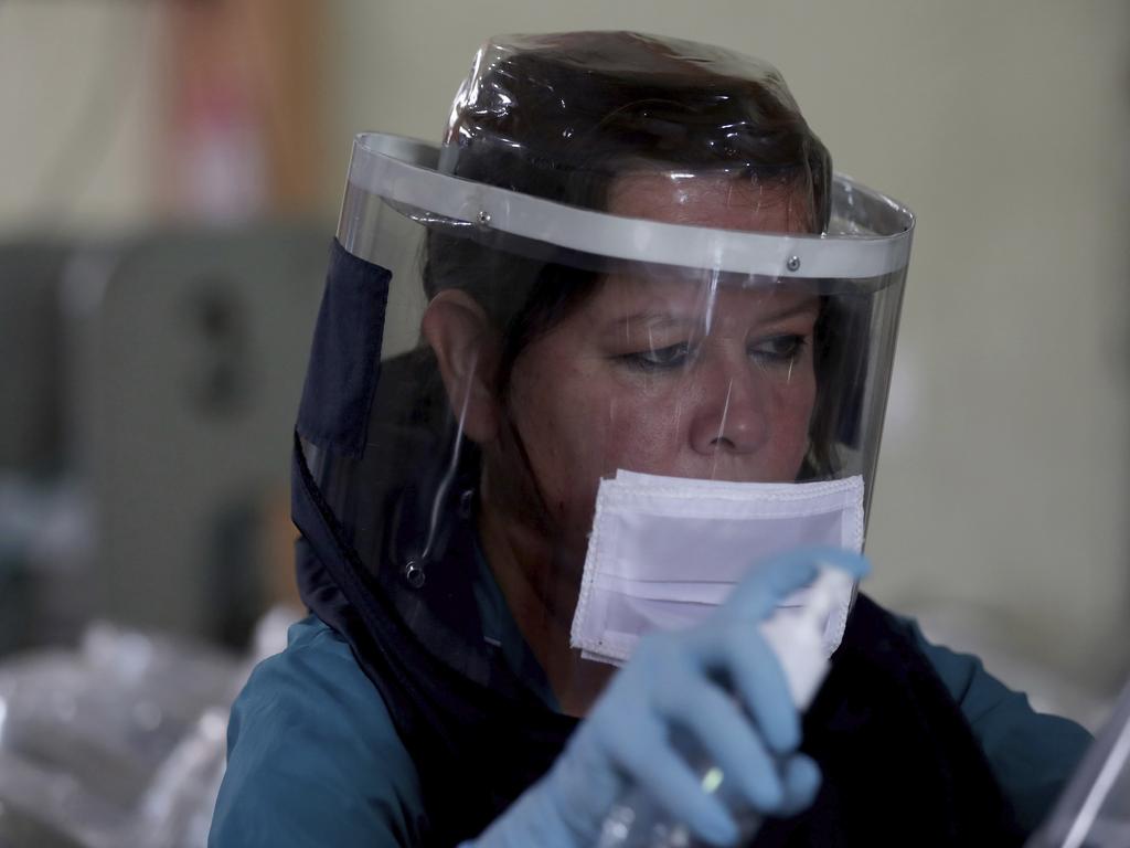 A workers wearing a protection mask against the new coronavirus in Bogota, Colombia. Picture: Fernando Vergara/AP