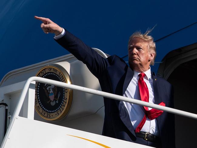 US President Donald Trump points as he boards Air Force One. Picture: AP