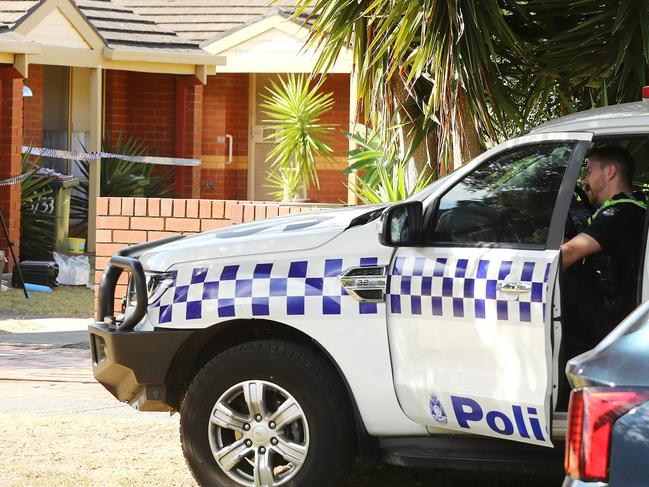 Police at the scene of a Godfrey St assault. Picture: Alison Wynd