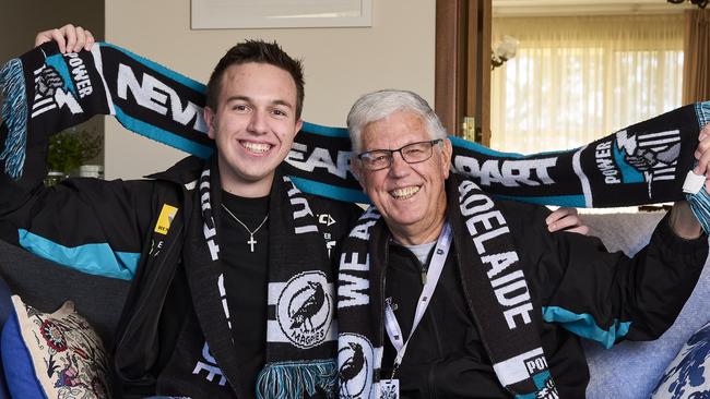 Josh Rogers with his grandfather, Kent Rogers at home in Coromandel Valley, where they managed to purchase preliminary final AFL tickets online. Picture: Matt Loxton