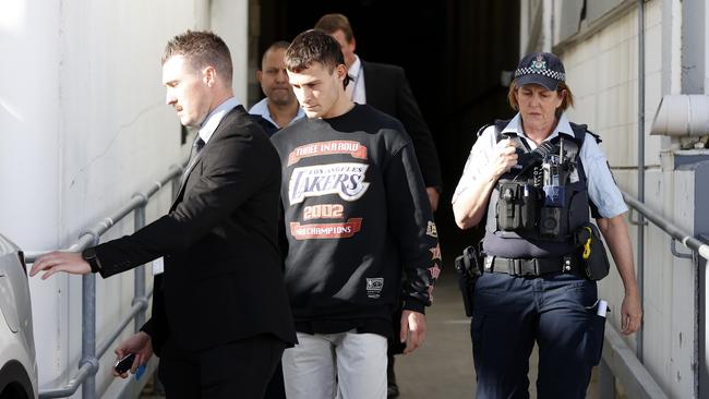 Garside was met by police when he touched down in Australia and taken to Mascot police station, where he was questioned and charged with assault. Picture: Jonathan Ng