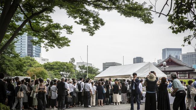 People line up for flower offering at Zojoji temple on the day of the funeral for former Japanese prime minister Shinzo Abe on July 12. Picture: Yuichi Yamazaki/Getty Images)