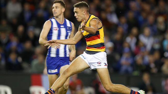 Lachlan Sholl kicks the Crows into attack. Picture: Michael Willson/AFL Photos via Getty Images