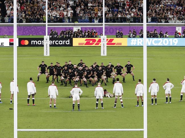 England players watch the All Blacks perform their haka during the Rugby World Cup semifinal at International Yokohama Stadium between New Zealand and England in Yokohama, Japan, Saturday, Oct. 26, 2019. (Kyodo News via AP)