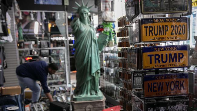 A shop owner in a looted shop near Times Square in New York last week. Picture: Getty Images