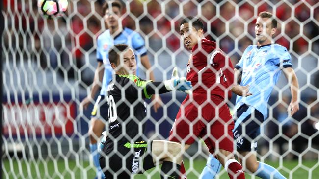 Roberto Firmino guides in Liverpool’s third goal against Sydney FC.