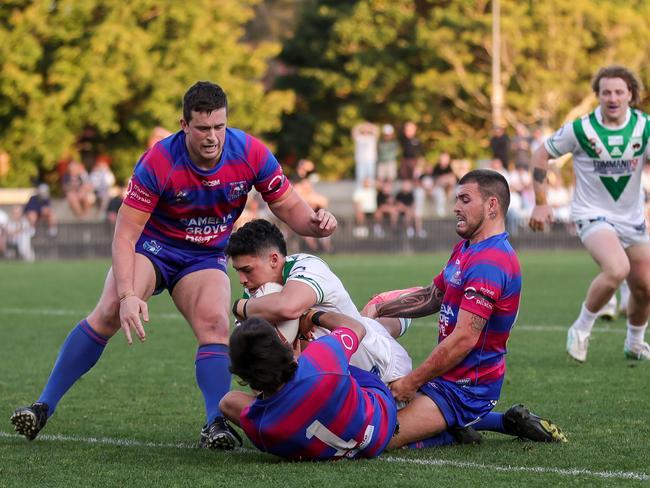 James Kokkinos attempting to beat 3 defenders to score. Picture: Adam Wrightson Photography