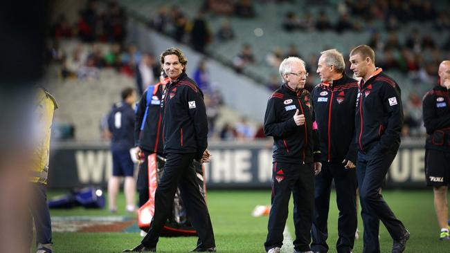 Coach James Hird with Danny Corcoran, Dr Bruce Reid and then Assistant Coach Simon Goodwin in 2013.