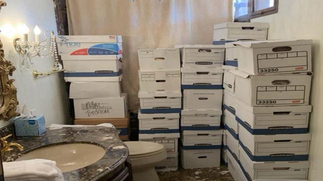 Evidence in the indictment against former US president Donald Trump shows stacks of boxes in a bathroom and shower allegedly in the Lake Room at Mar-a-Lago, the former presidents private club. (Photo by Handout / US DEPARTMENT OF JUSTICE / AFP)