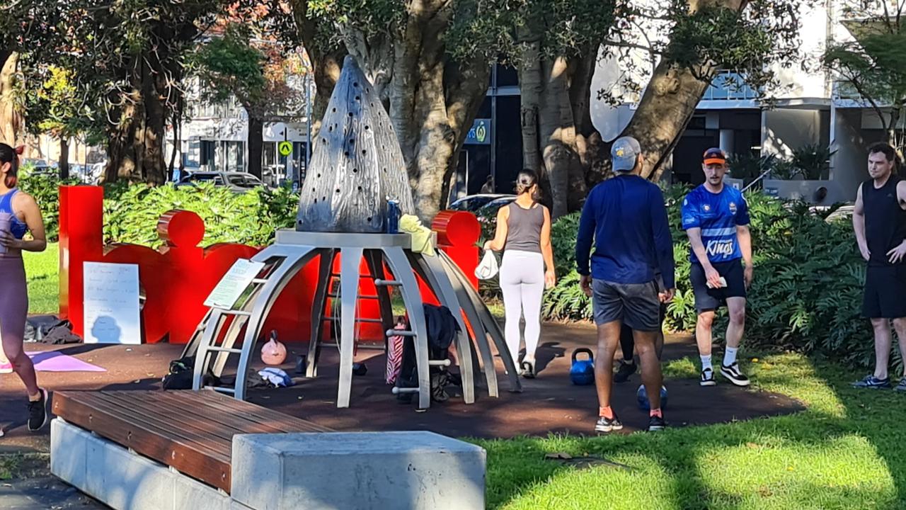 One of half a dozen groups exercising in Redfern Park on Saturday morning. Picture: CJS Media