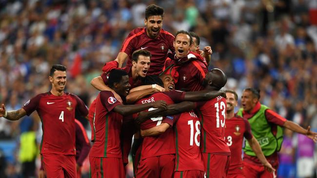 Portugal players celebrate winning after the UEFA EURO 2016 Final.